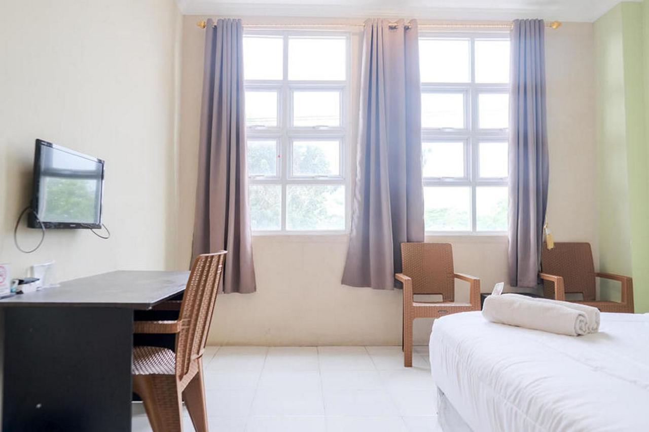 Urbanview Hotel Ta Ke Jelutung Puncak Джамби Экстерьер фото